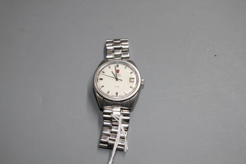 A gentlemans stainless steel Omega Electronic f300 chronometer wrist watch, on Omega bracelet.